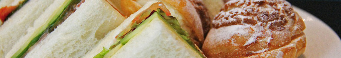 Eating Deli Sandwich at Baja Sur MX Cafe & Deli restaurant in Fresno, CA.